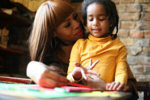 Woman and girl counting w fingers